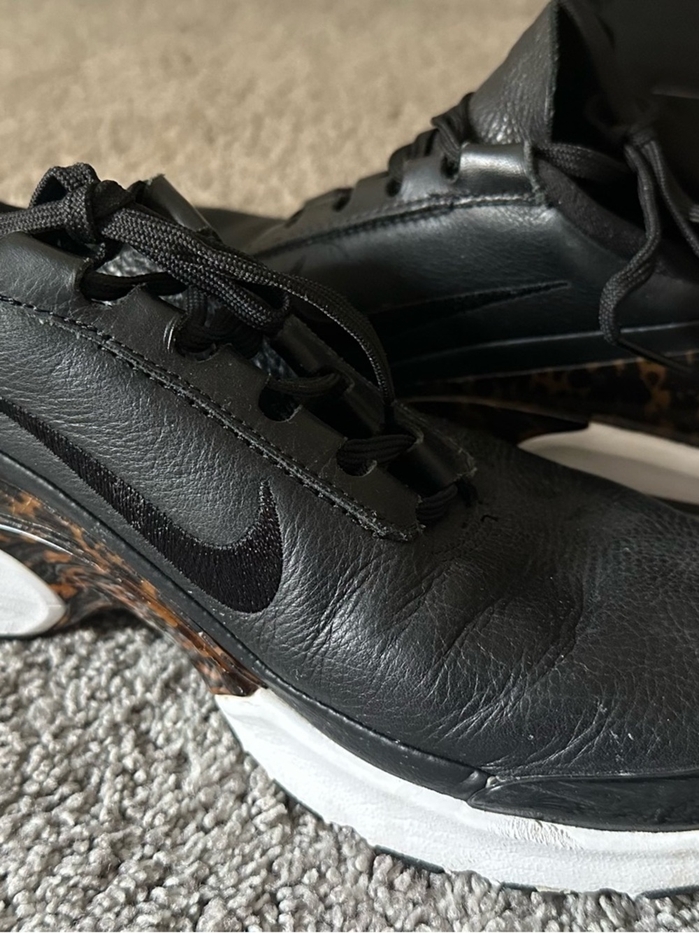 Nike Black Leather Sneakers with Tortoise Midsole Accent